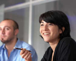 Smiling women 'gets the point' in a meeting