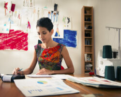 Young woman service provider calculates expenses
