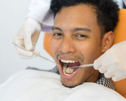 Dental patient opens his mouth for a cleaning