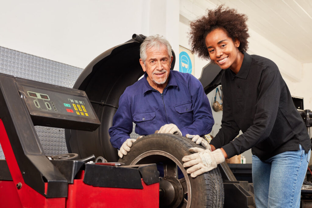 African woman apprentice to automotive instructor