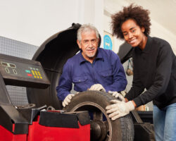 African woman apprentice to automotive instructor