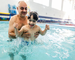 Child with Disability in a swimming class. Good example of social rec