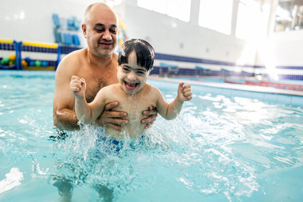Child with Disability in a swimming class. Good example of social rec