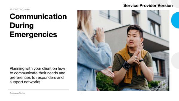 Communication During Emergencies “A woman in a denim jacket signing to a seated man who responds with sign language outside a modern building.”