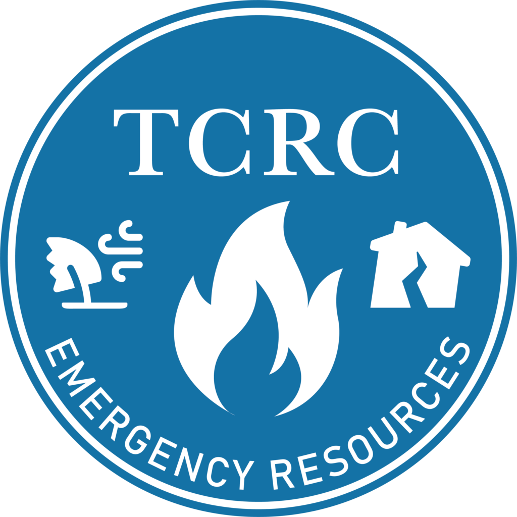 TCRC circular light blue logo with white text. "TCRC" centered above, in the middle, is a large flame icon with a tree blowing in the wind to the left, and a leaning house with a crack on the right. On the bottom are the words "Emergency Resources"