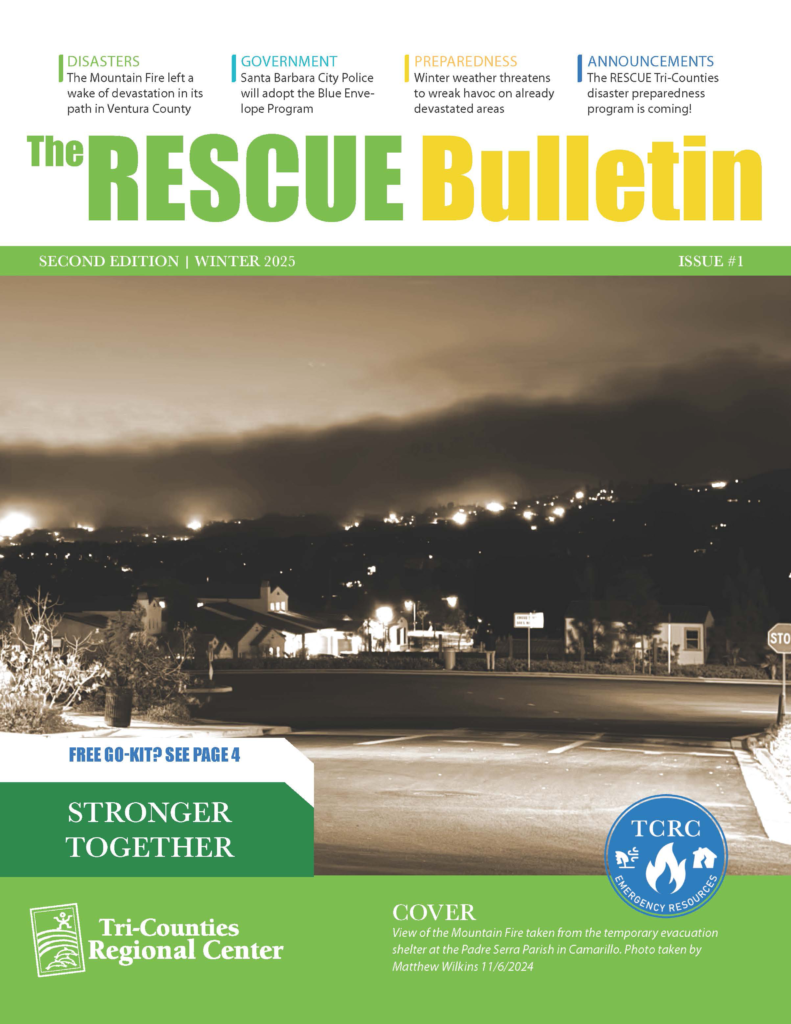 Sepia-toned nighttime photo of a suburban street and distant hillside ablaze from the Mountain Fire. Above the image, the title reads ‘The RESCUE Bulletin Second Edition | Winter 2025 Issue #1.’ A white callout box on the cover reads ‘Free Go-Kit? See Page 4.’ A green banner at the bottom says ‘Stronger Together’ above the Tri-Counties Regional Center logo and a blue TCRC Emergency Resources emblem.