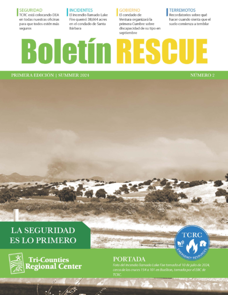 Sepia‐toned cover titled ‘Boletín RESCUE Primera Edición | Summer 2024’ with a wide California landscape of rolling hills and a plume of smoke rising from a distant wildfire. A green banner at bottom reads ‘La seguridad es lo primero’ above the Tri-Counties Regional Center logo and a TCRC Emergency Resources emblem.