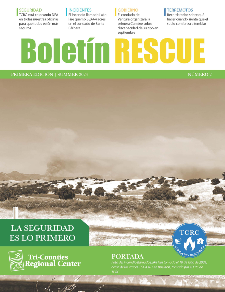 Sepia‐toned cover titled ‘Boletín RESCUE Primera Edición | Summer 2024’ with a wide California landscape of rolling hills and a plume of smoke rising from a distant wildfire. A green banner at bottom reads ‘La seguridad es lo primero’ above the Tri-Counties Regional Center logo and a TCRC Emergency Resources emblem.